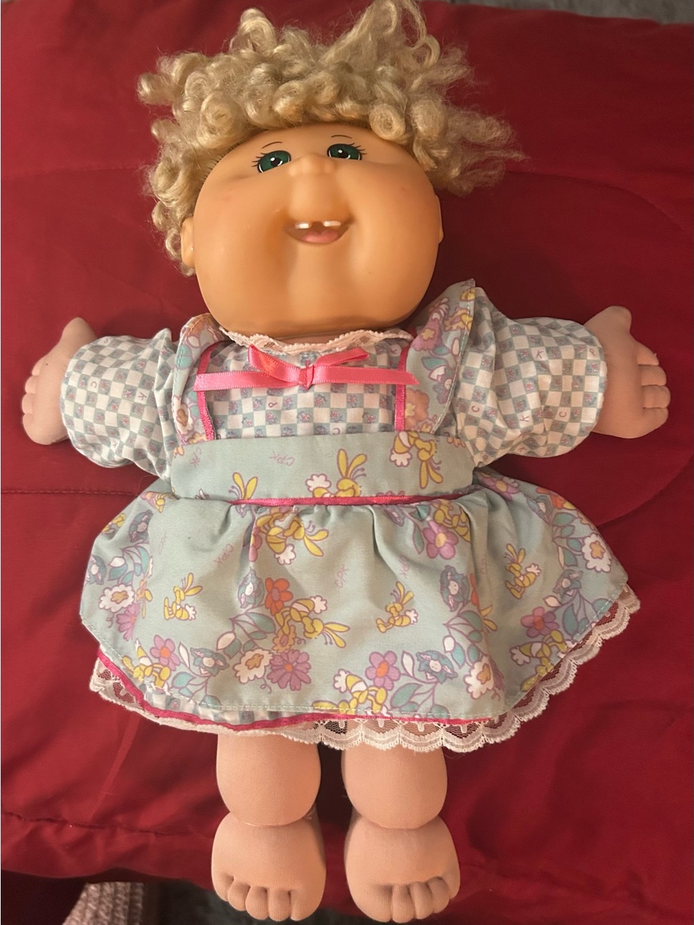 Blonde Curly-Haired Baby Doll in Floral Light Blue Dress